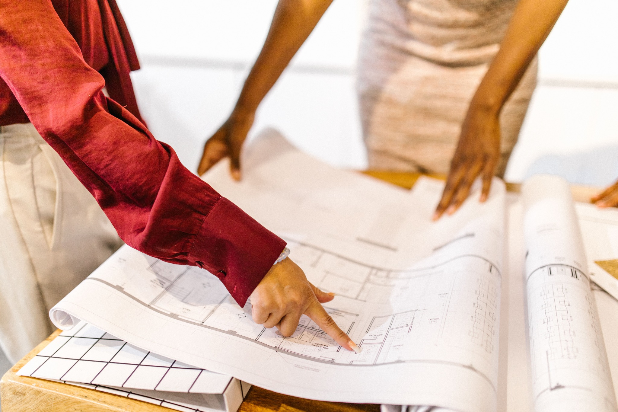 Architectural drawings and plans being reviewed at a work table